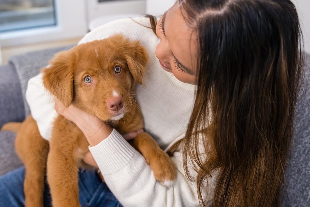 puppy in womans arms