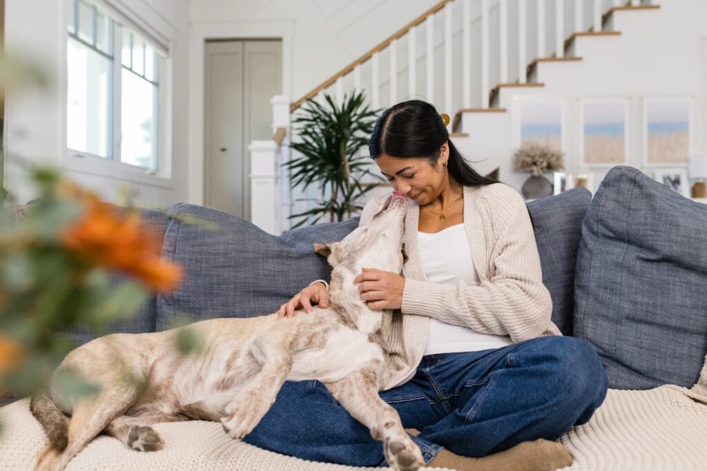 dog and woman cuddling