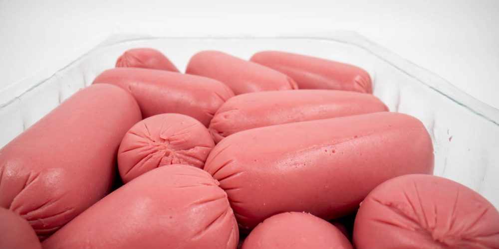 Uncooked sausages close up isolated.